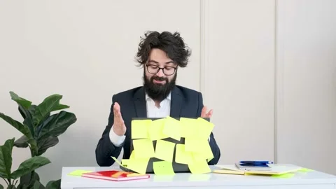 Bearded man comfortable at his desk, in underwear and jacket working remote. Stock Footage 152980019