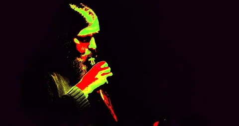 Bearded man in the dark smoking an e cigarette infrared view initation Stock Footage 88059668