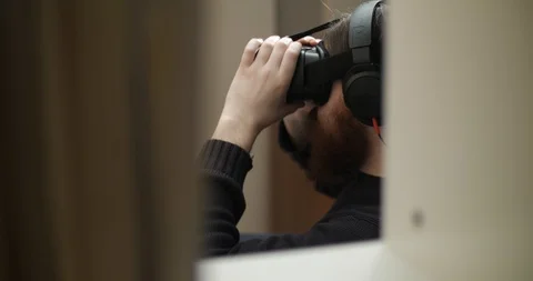 Bearded man dresses virtual reality glasses Stock Footage 88059487