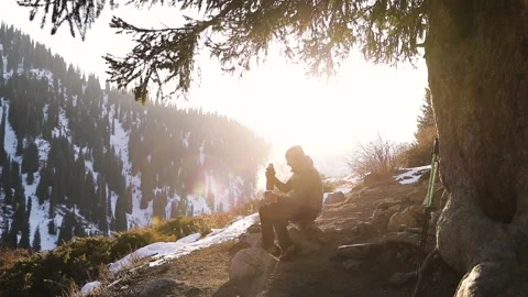 Bearded man drink coffee in winter mountains Stock-Footage 167470226