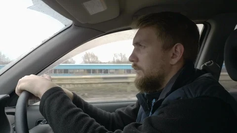 Bearded man driving a car Stock Footage 105720364