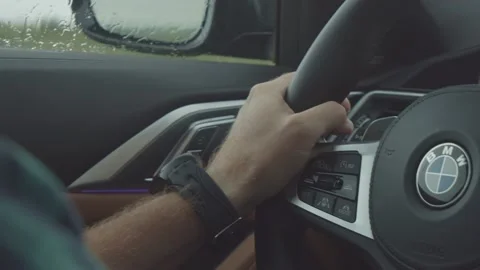 Bearded man driving in the rain 库存影片 159755218