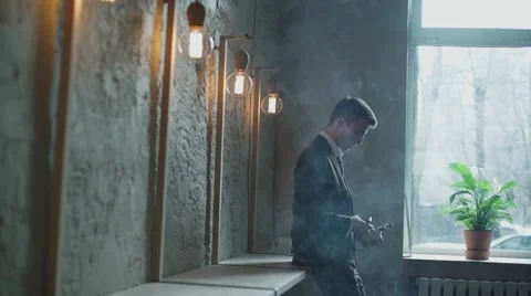 Bearded man with e-cigarette in the cafe vape vaping Stock Footage 56895866