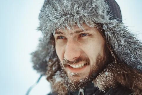 A bearded man in an earflap in winter 库存照片
