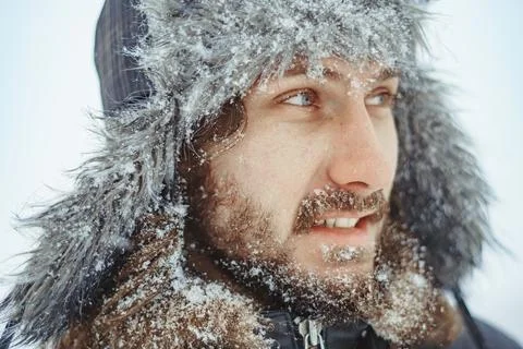 A bearded man in an earflap in winter Stock Photos