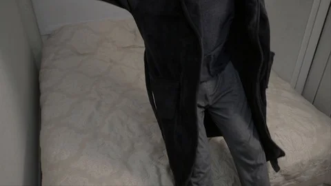 Bearded man falling on bed in slow motion Stock Footage 104304222