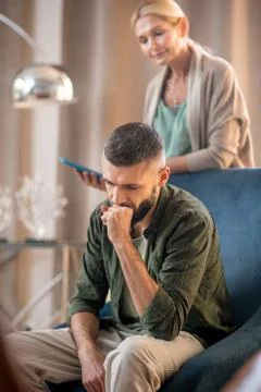 Bearded man feeling stressed while coming to psychologist Stock Photos