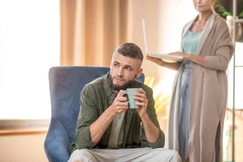 Bearded man feeling thoughtful while visiting psychoanalyst 스톡 사진