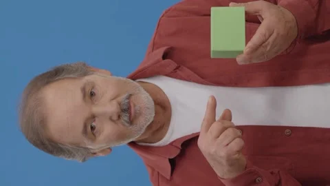 The bearded man in front of a blue background with green box. Stock Footage 151994159