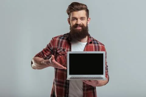 Bearded man with gadget Stock Photos