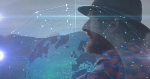 Bearded man gazing right in technology scene, showcasing glowing globe nodes and Stock Footage 330179852