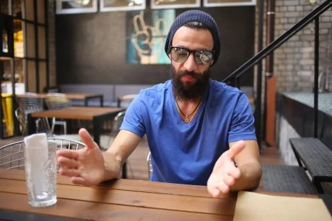 Bearded man gesticulate with hands Stock Photos