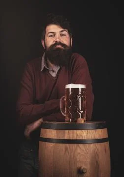 Bearded man with a glass of beer. Concept of craft beer. Man with beer on balck Stock Photos