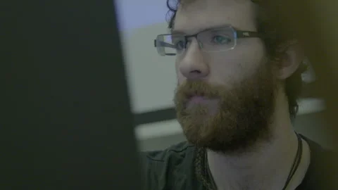 Bearded Man in Glasses Working at Computer Screen Stock Footage 341863235