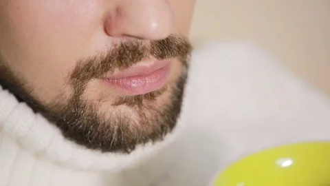 Bearded Man Having a Cup of Tea a sweater Stock Footage 71419536