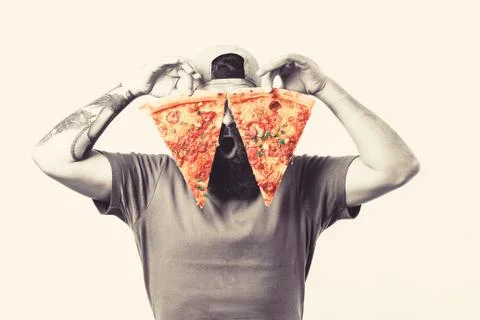 Bearded man holding two slice of delicious pizza on white background. Stock Photos