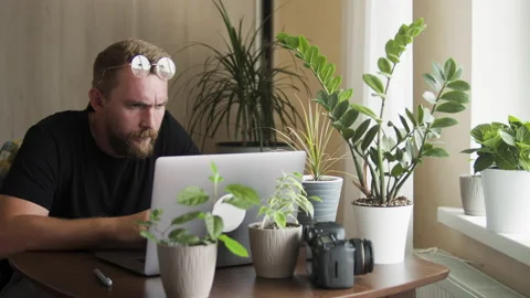 Bearded man in home office Stock Footage 156962796