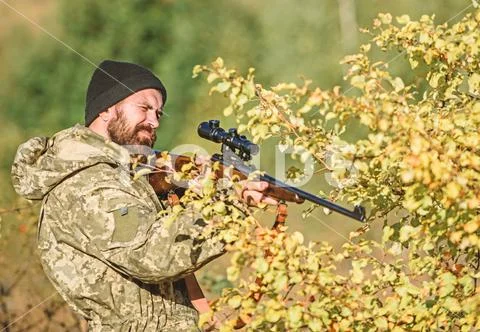 Bearded man hunter. Military uniform fashion. Army forces. Camouflage. Hunting Stock Photos