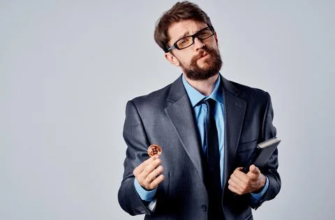 Bearded man internet technology commerce bitcoin mining light background Stock Photos