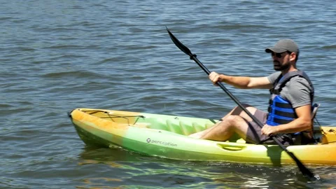 Bearded Man Kayaking on Lake Stock Footage 95947491
