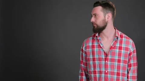 Bearded man keeps his hand in pockets Stock-Footage 251463472