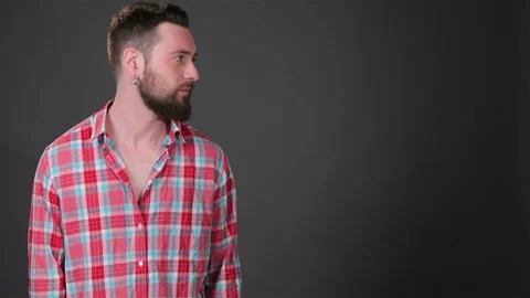 Bearded man keeps his hand in pockets Stock Footage 311818912