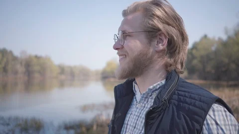 Bearded man looking at amazing view of river and forest Stock Footage 108550305