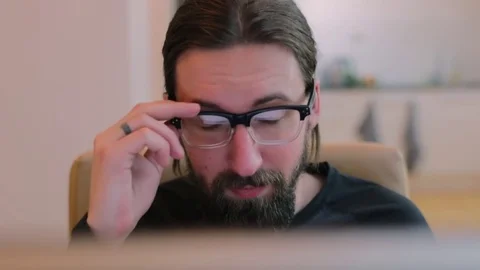 Bearded man in office take off his glasses Stock Footage 73178253