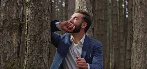 Bearded man in pine forest, thinking and enjoying air Stock Footage 140267856