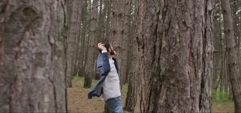 Bearded man in pine forest, walking and enjoying air Stock Footage 140265002