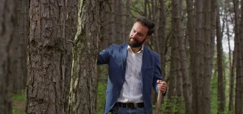 Bearded man in pine forest, walking and enjoying air Stock Footage 140268208