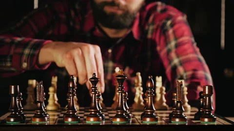 Bearded man playing chess alone, close-up Stock Footage 147929145