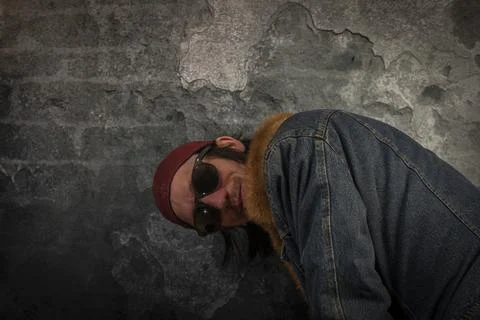 Bearded man portrait near old stone brick wall Stock Photos