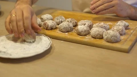 A bearded man prepares meat cutlets at home in the kitchen, a ban on visiting re Stock Footage 145409257