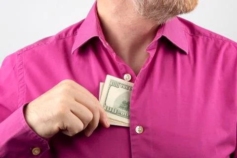Bearded man pulls out money in a shirt Stock Photos