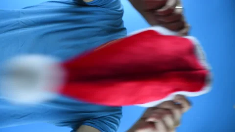 Bearded man puts on a Santa hat, vertical video Stock-Footage 141638272