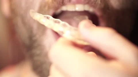 Bearded man putting on unloading splint Stock Footage 149873854