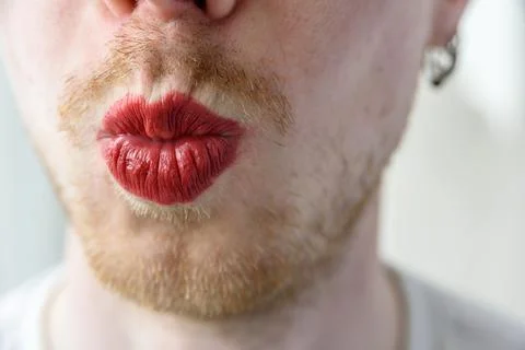 Bearded man with red lipstick Stock Photos