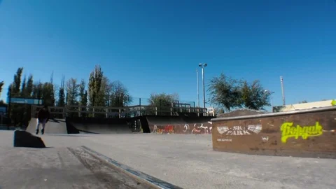 Bearded man with roller skates performing a stunt on a ramp Stock-Footage 74019388