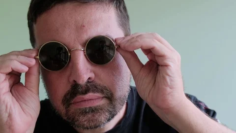 Bearded Man in round Eyeglasses Looking to Camera, ShowThump Up Stock Footage 111575565