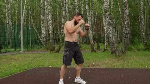 Bearded Man Shadowboxing Workout Outdoors Video stock 330044274
