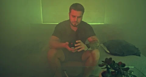 Bearded man shaking Magic 8 Ball Stock Footage 108033885