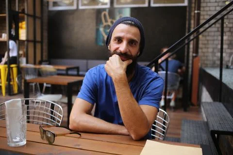 Bearded man sitting in cafe Stock Photos