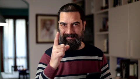 Bearded man smiling confidently pointing finger at camera. Stock Footage 266302528