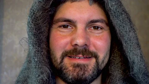 Bearded man smiling in a warm shawl 4K Vídeo Stock 118640795