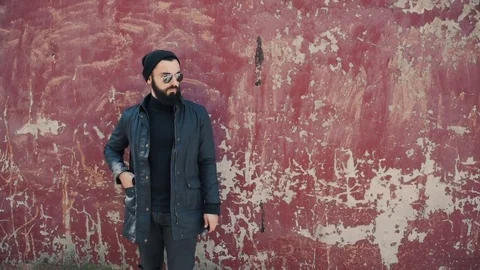 Bearded man smokes electronic cigarette Stock Footage 74139823