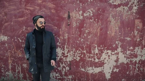 Bearded man smokes electronic cigarette Stock Footage 74141228