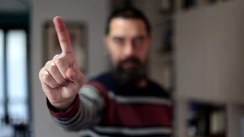 Bearded man standing with serious expression saying no with finger at home. Stock Footage 266302652