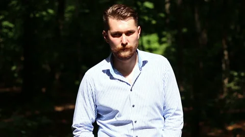 Bearded man stands in the Sun Ray Stock Footage 66063619