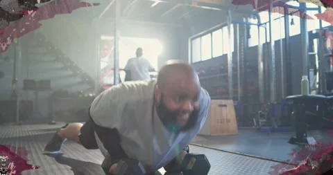 Bearded man starting pushup grip, switching weights rows on mat with animated Stock Footage 330647212
